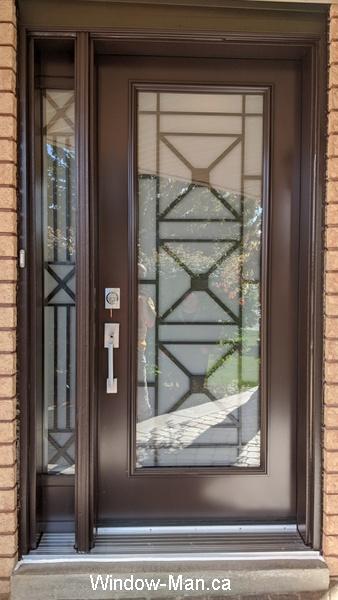 Front door. Brown. Iron sidelight. Century wrought iron glass insert. Antique brown